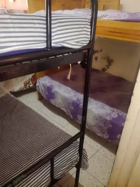 A bed in an indoor bedroom